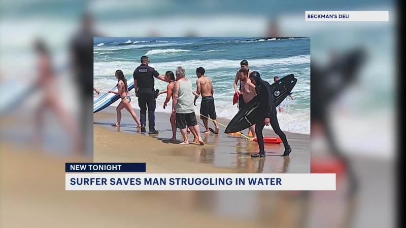 Story image: Jersey Shore surfer whose 20-foot wipeout went viral helps rescue struggling swimmer