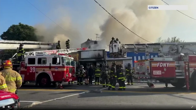 Story image: FDNY: Commercial strip fire extinguished in Wakefield; 4 firefighters with minor injuries 