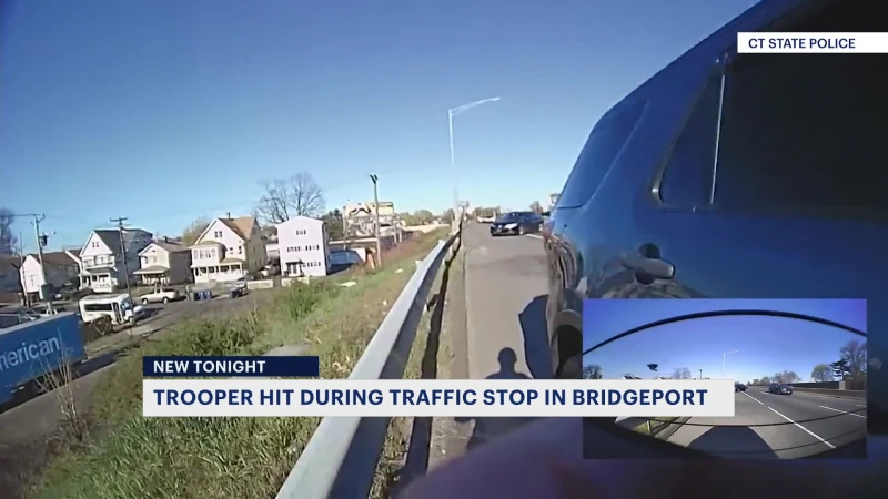 Story image: Video released by CSP shows the moment a Connecticut state trooper is struck by a car on I-95 in Bridgeport