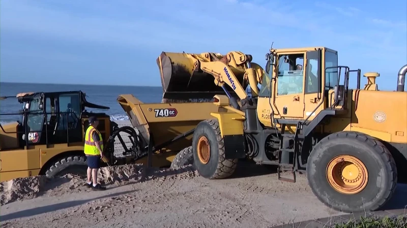 Story image: Sand delivered to Tobay Beach as crews work on opening access to the beach