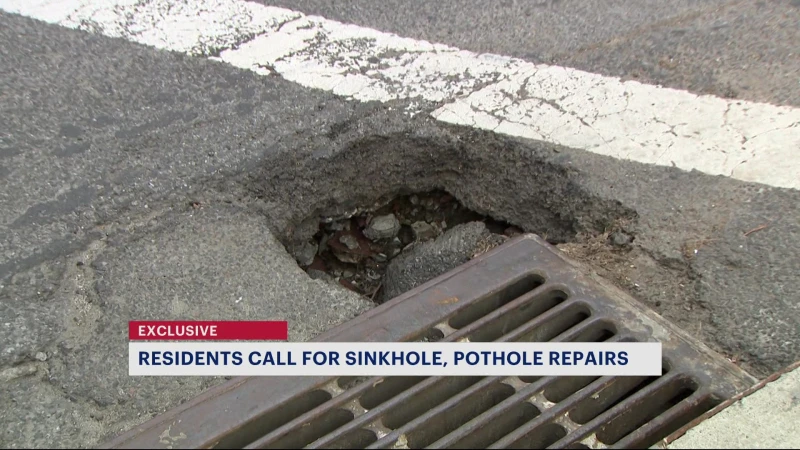 Story image: Residents demand repairs on pothole, sinkhole near Morris Heights intersection