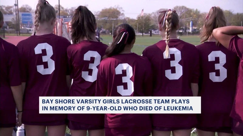 Story image: Bay Shore HS varsity girl's lacrosse team 'Play For Pearl' in memory of 9-year-old