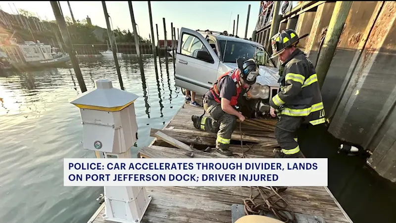 Story image: Car crashes through fence at marina in Port Jefferson, lands on floating dock