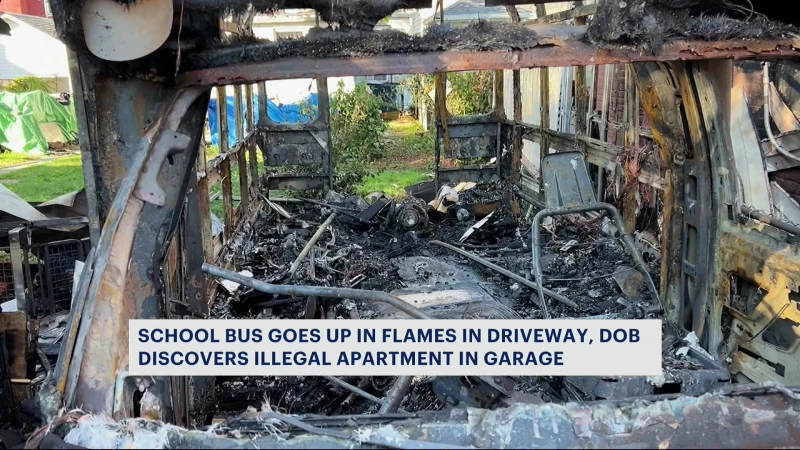 Story image: Unoccupied school bus goes up in flames; building officials find illegally occupied garage next door