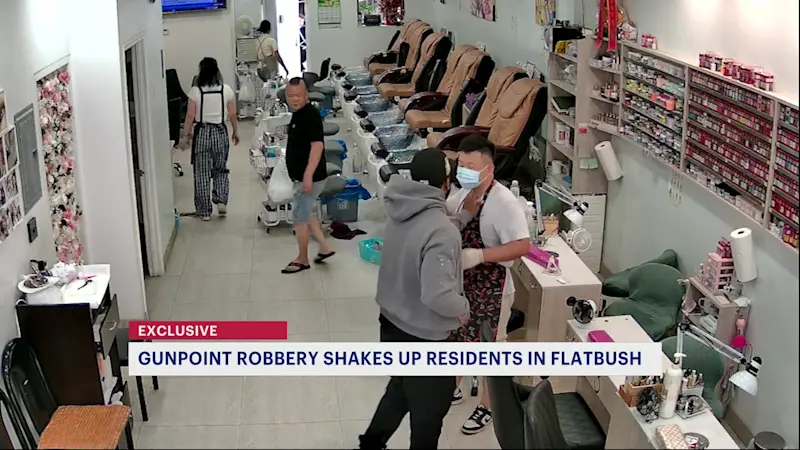 Story image: Flatbush nail salon gunpoint robbery caught on camera