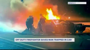 Off-duty firefighter rescues man in burning car 