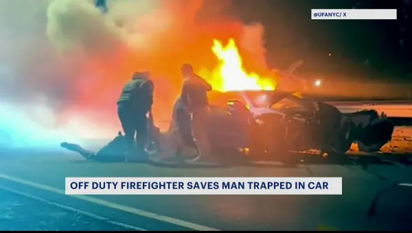Off-duty firefighter rescues man in burning car 