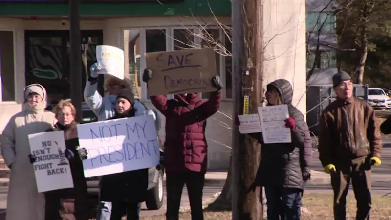 Story image: Hundreds protest outside Suffolk Republican congressman's office