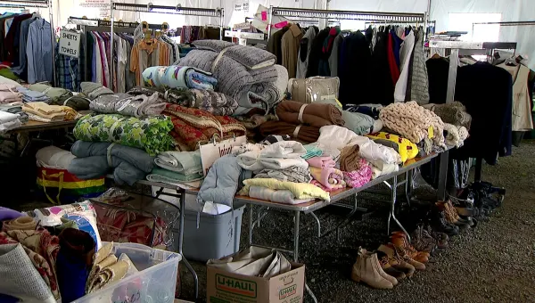 Volunteers prep for Minks to Sinks sale to benefit Family and Children's Agency