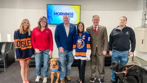 Islanders service dog in training, graduated service dog stops by News 12 studios
