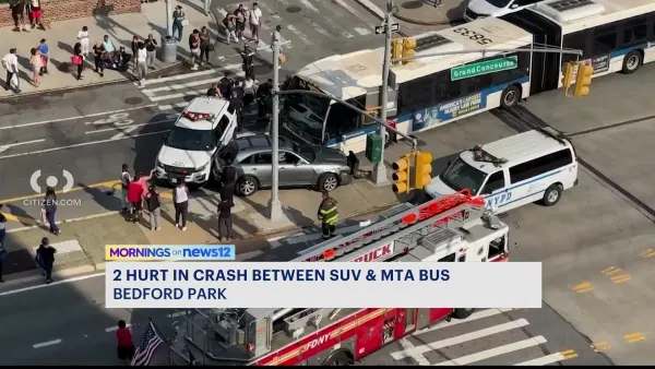 Police: 2 passengers injured when SUV collides with bus in Bedford Park