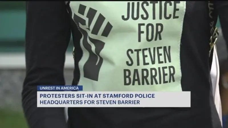 Story image: Residents hold 8-hour protest at police headquarters for Stamford man who died in custody