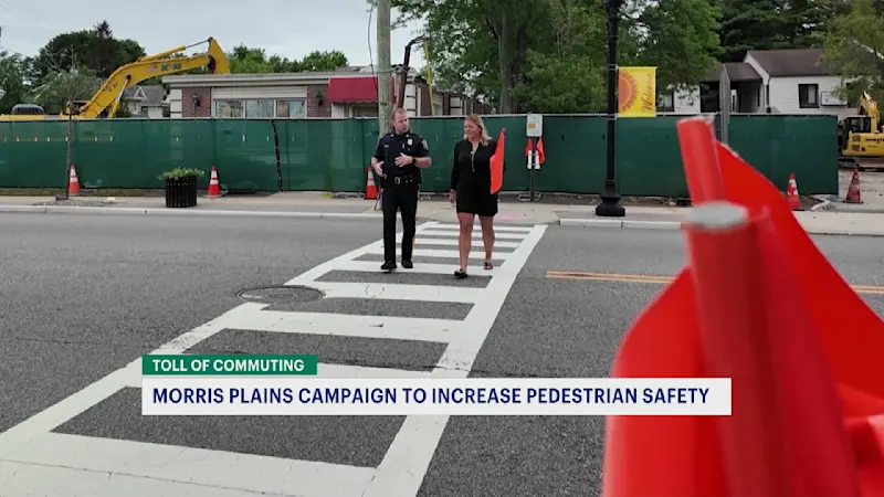 Story image: Toll of Commuting: Morris Plains crosswalk flags provide safety for those commuting on foot