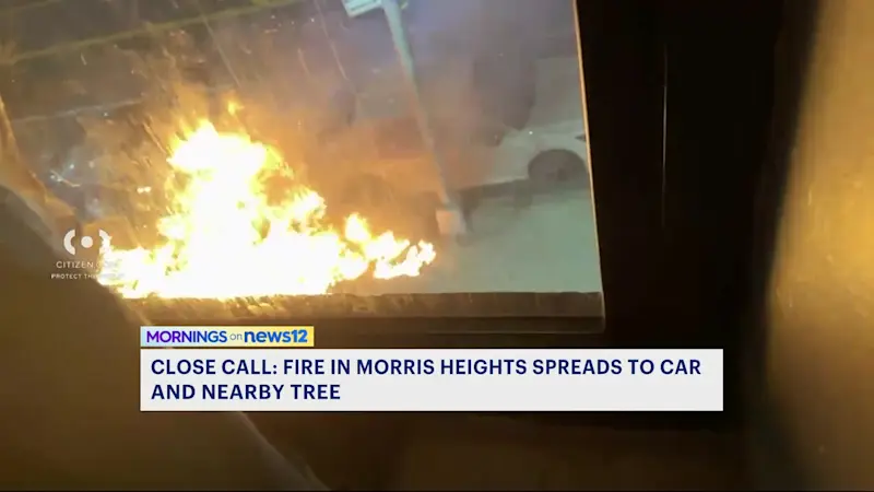 Story image: Citizen app video shows trash fire spreading to car and tree