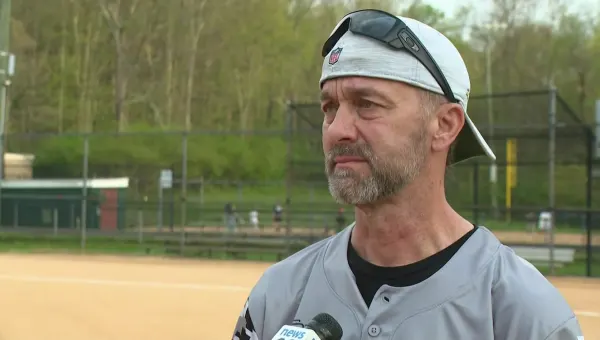 Former Somers HS coach throws 1st pitch at opening game following virus that nearly killed him