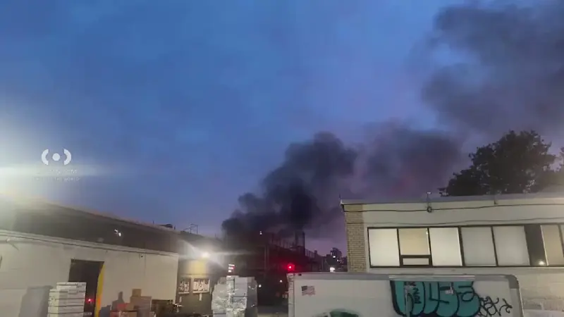Story image: Heavy smoke seen billowing from construction site fire in Williamsburg