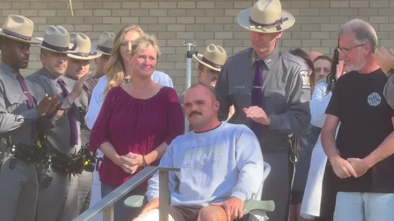 Story image: 'Walk Out' ceremony held as New York State Police trooper released from hospital after shooting