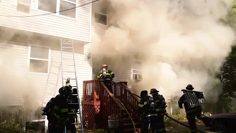 Story image: Suffolk police officers, Central Islip firefighters rescue 2 women from house fire