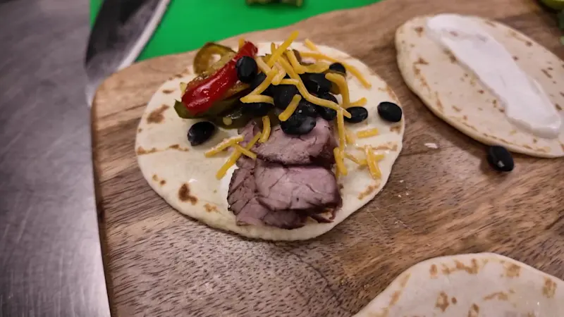 Story image: The BBQ King creates sizzling fajitas from flank steak