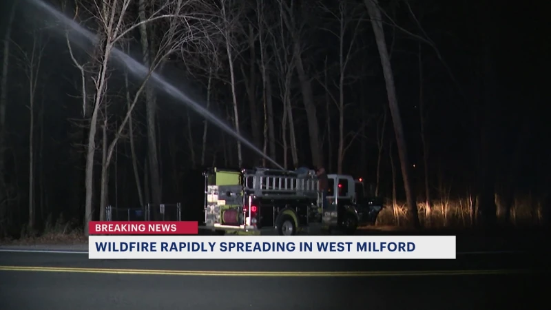 Story image: West Milford wildfire 10% contained; officials address line-of-duty death