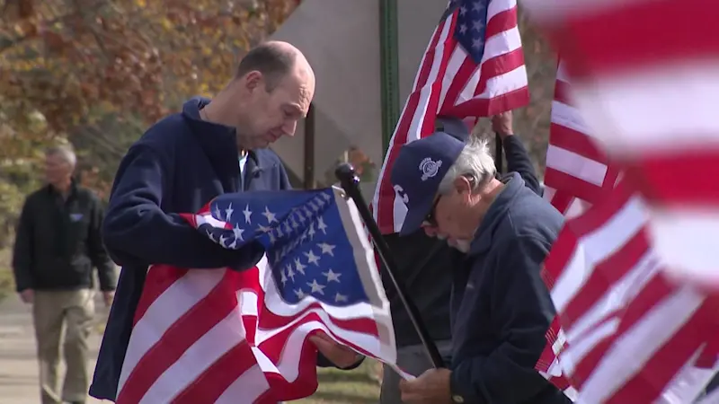 Story image: Spring Lake honors veterans past and present with dozens of American flags and honor plaques