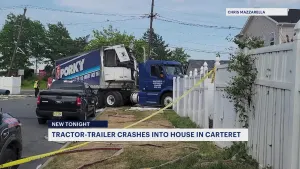 Tractor-trailer crashes into 2 Carteret homes, narrowly missing children at play