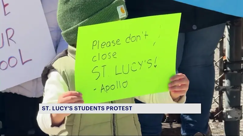 Story image: Students hold rally in front of their Allerton Catholic school to protest impending closure