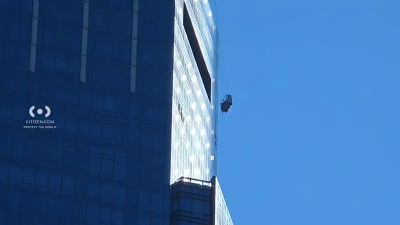 Story image: DRAMATIC VIDEO: 2 workers rescued from scaffolding while washing windows in Manhattan