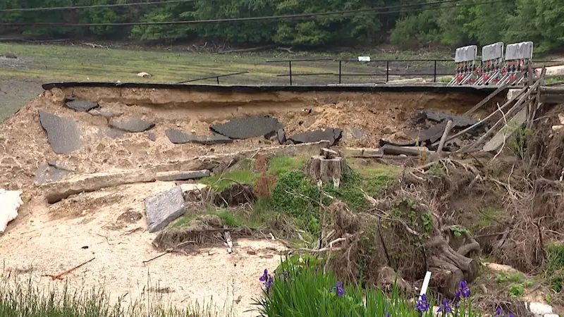 Story image: Residents demand damaged Stony Brook road and pond be fixed, 10 months after historic flooding