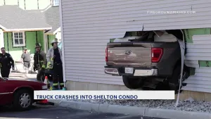 Firefighter injured when truck crashes into Shelton condo