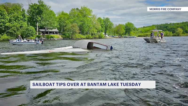 Story image: Emergency responders rescue overturned boat on Bantam Lake
