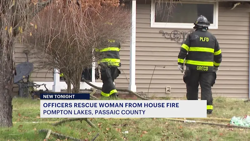 Story image: Pompton Lakes police officers rescue woman from burning home