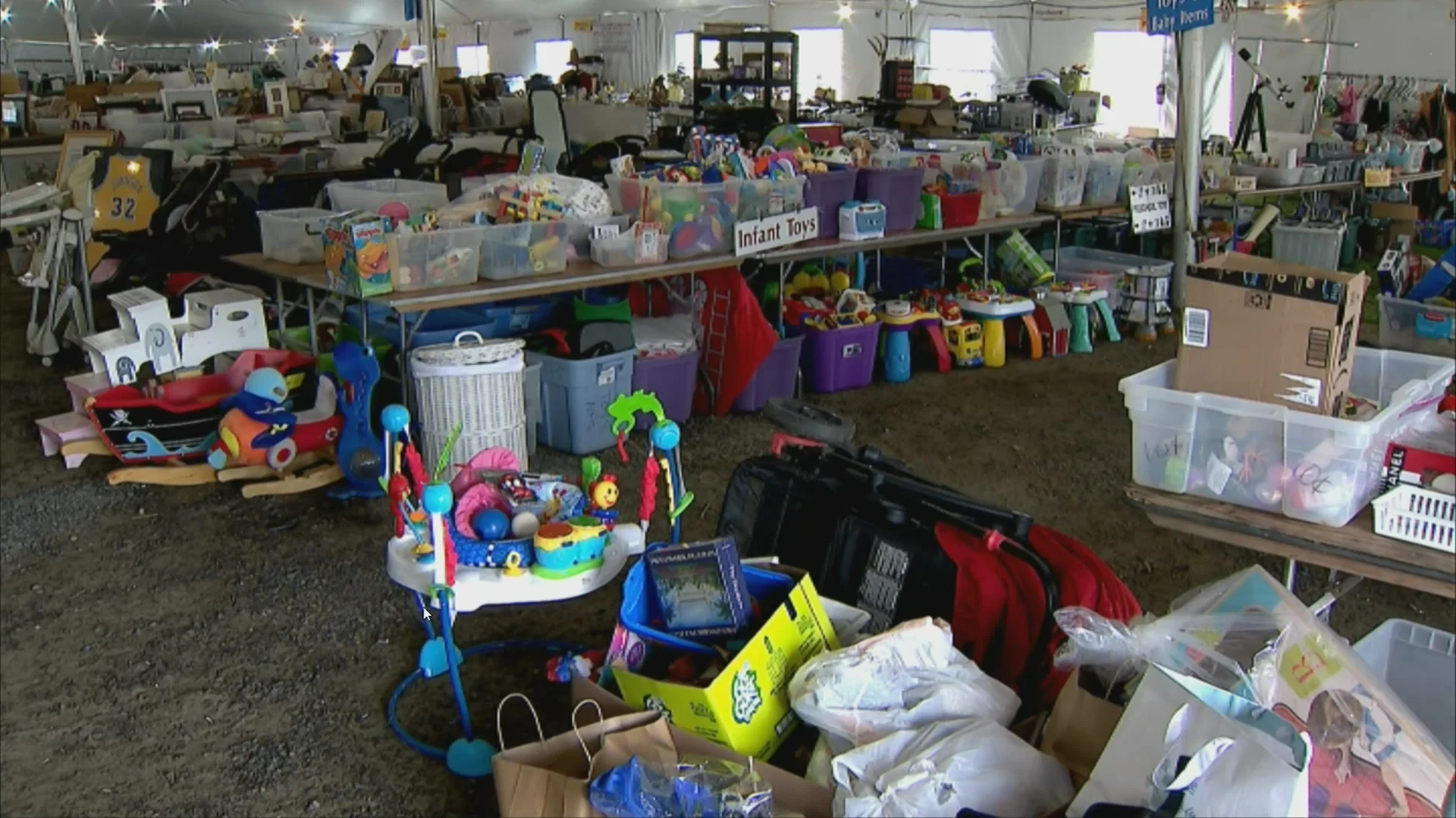 Volunteers prep for Minks to Sinks sale to benefit Family and Children's Agency