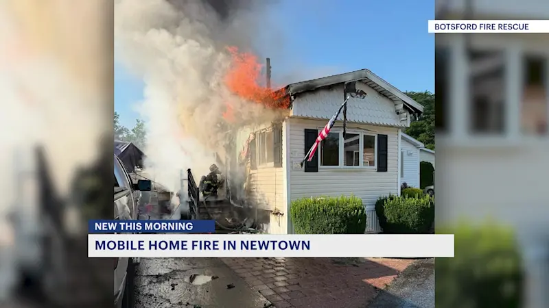 Story image: Mobile home destroyed by fire in Newtown 