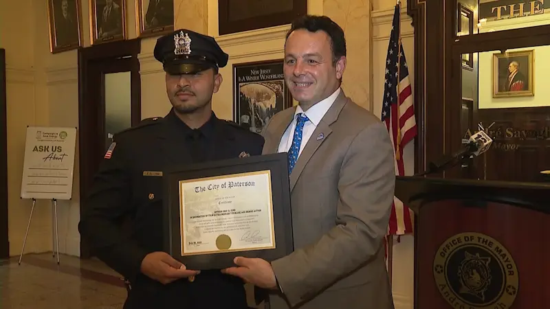 Story image: Police officer saves woman from falling over Paterson Great Falls