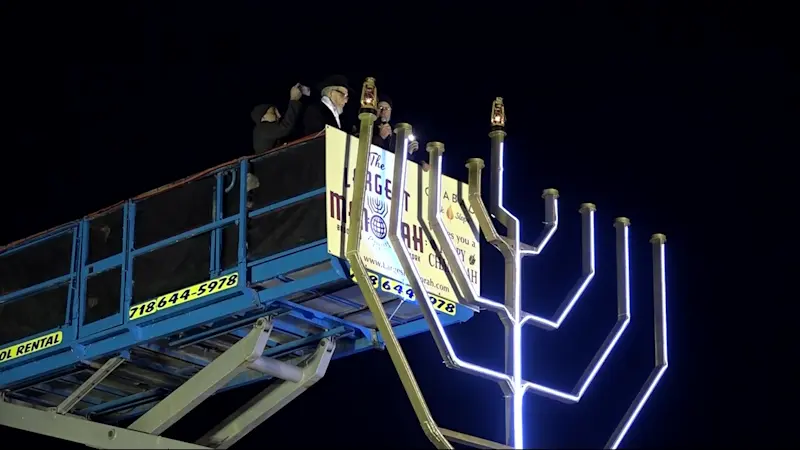 Story image: People gather in Grand Army Plaza to celebrate Hanukkah, light one of the largest menorahs in the world