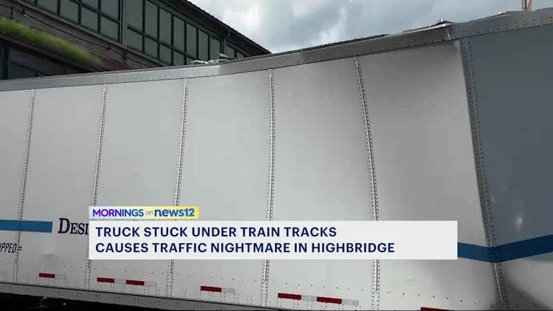 Story image: Truck gets stuck for hours under elevated train tracks in Higbridge