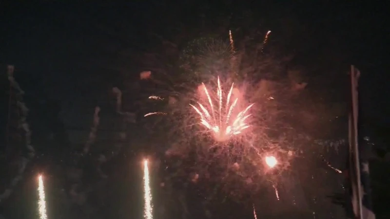 Story image: Fireworks light up sky above Eisenhower Park in Fourth of July celebration