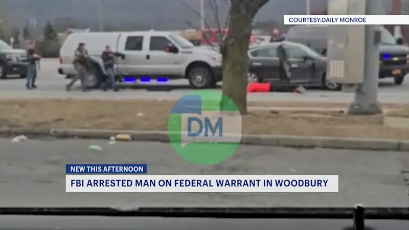 Story image: VIDEO: FBI seen with guns drawn during arrest on Route 32 in Woodbury