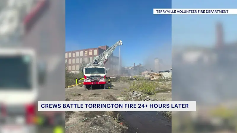 Story image: Crews battle hot spots as Torrington fire burns into second day