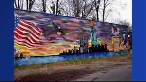 Team of artists restore 9/11 memorial mural in City Island