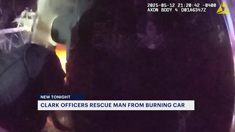 Story image: Clark police officers rescue man from burning car following crash