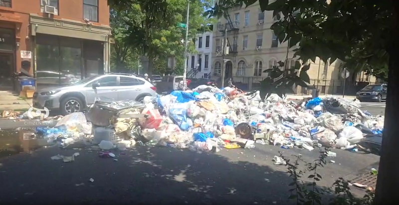 Story image: Garbage truck fire in Bedford-Stuyvesant leaves trash piled in street