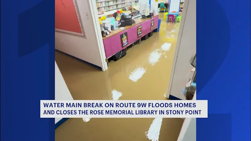 Story image: Stony Point Library and homes damaged by sudden flood from water main break