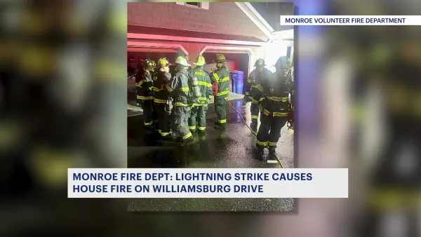 Officials: Lightning strike causes Monroe house fire