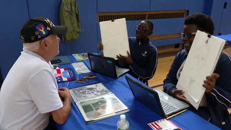 Story image: 8th graders in New Hyde Park sketch portraits of LI veterans