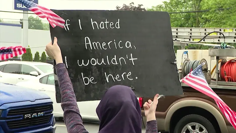 Story image: ‘We’re supposed to be united.’ ‘No Kings’ demonstrators rally outside Babylon Town Hall
