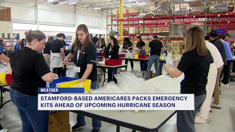 Story image: Volunteers at Americares pack emergency kits ahead of hurricane season