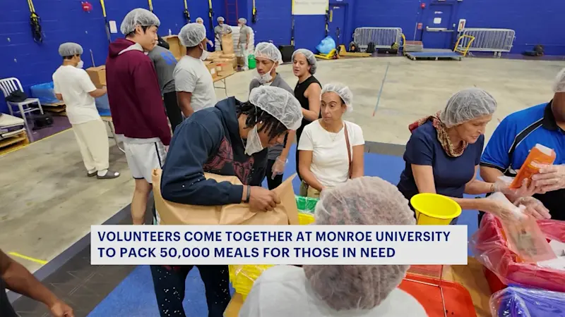 Story image: Monroe University students pack 50,000 meals for 9-11 day of service