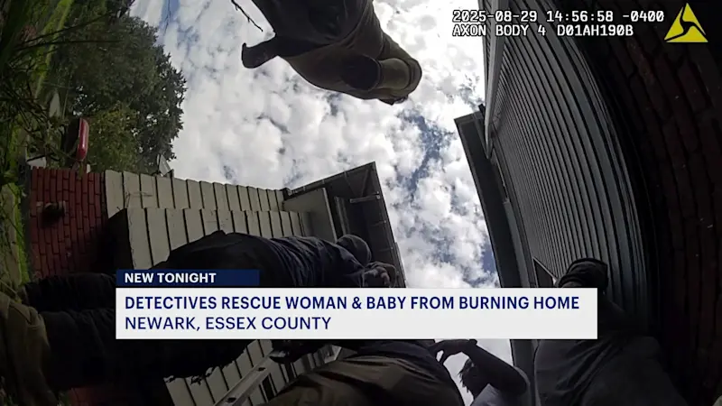 Story image:  Summit police rescue woman, toddler from burning home in Newark